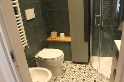 a bathroom with a toilet and a shower at Vaticano Roma Guesthouse in Rome