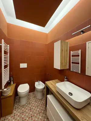 a bathroom with a toilet and a sink at Vaticano Roma Guesthouse in Rome