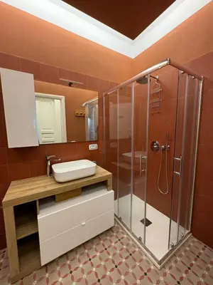 a bathroom with a sink and a shower at Vaticano Roma Guesthouse in Rome