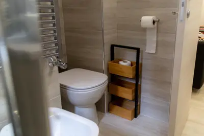 a small bathroom with a toilet and a sink at La casa di Nonna Peppina a Trastevere in Rome