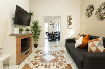 a living room with a couch and a fireplace at San Peter Borgo 68 in Rome