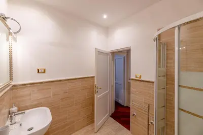 a bathroom with a sink and a shower at City Center Apartment - Pantheon in Rome