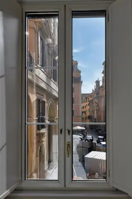 a window with a view of a city at City Center Apartment - Pantheon in Rome