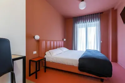 a bedroom with a bed and a window at Luciano Queen's Guest House in Rome