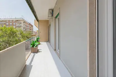 an empty balcony of a building with plants at Luciano Queen's Guest House in Rome