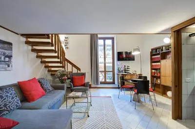 a living room with a couch and a table at Dimora dell'Orso in Rome