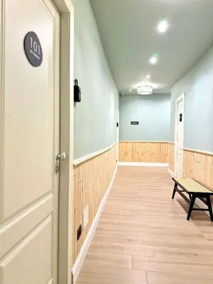 an empty hallway with a door and a bench at My Maison Italy GuestHouse in Rome
