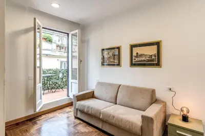 a living room with a couch and a window at Frattina Grand Suite - Vacanze Romane Apartments in Rome