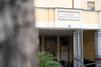 a building with a sign for a state music office at Casa per Ferie Santa Maria alle Fornaci in Rome