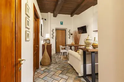 a living room with a couch and a table at Campo dei Fiori Nest Apartment in Rome