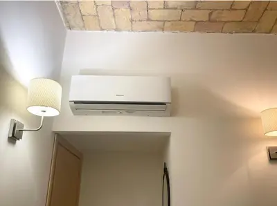 a bathroom with a window and a white curtain at Casa Metro A PONTELUNGO in Rome