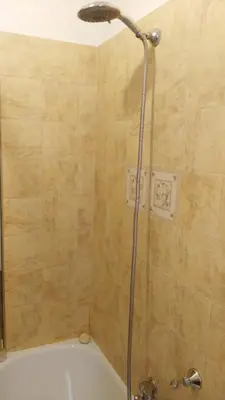 a shower in a bathroom with a tub at Piccolo Nido in Rome