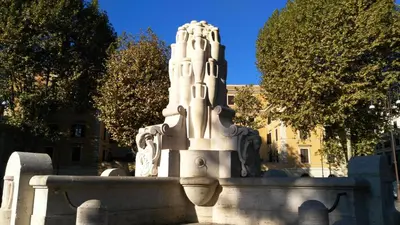 a statue in front of a building with trees at Piccolo Nido in Rome