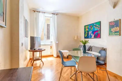 a living room with a table and chairs at iFlat Bright & Comfortable Navona apartment in Rome