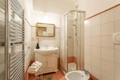 a bathroom with a sink and a shower and a toilet at iFlat Bright & Comfortable Navona apartment in Rome
