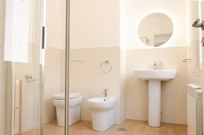 a bathroom with a toilet and a sink at Domus Angelina in Rome