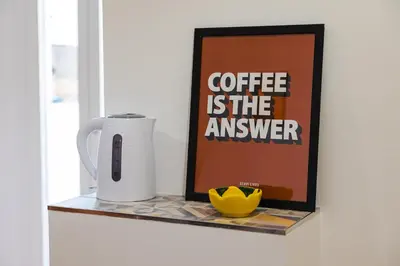 a counter with a coffee is the answer sign at Domus Angelina in Rome