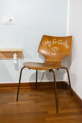 a chair with the words only for chairs written on it at Dolce Far Niente in Rome
