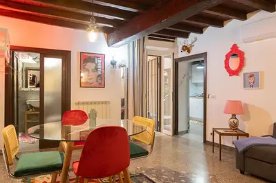 a dining room with a glass table and chairs at Dolce Far Niente in Rome