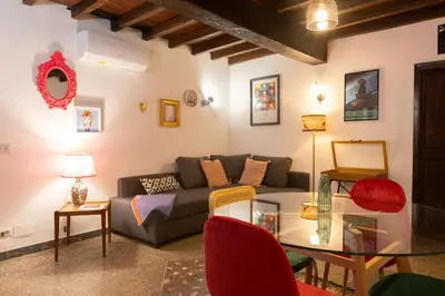 a living room with a couch and a glass table at Dolce Far Niente in Rome