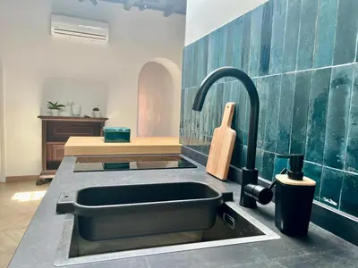 a kitchen with a sink and a sink at Trastevere Grand Suites in Rome