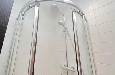 a shower with a shower head in a bathroom at Vestali House in Rome