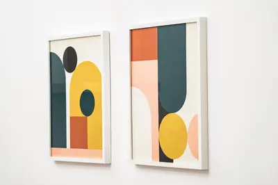 two pieces of colorful art on the wall at Domina Apartments Roma - San Pietro 2 in Rome