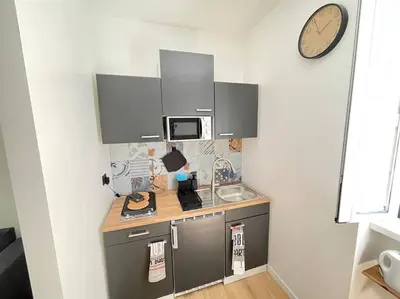 a small kitchen with a sink and a microwave at Basilica San Giovanni Appia Antica A casa di Amici in Rome