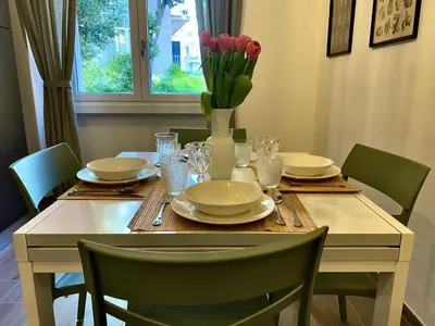 a kitchen counter with a coffee maker and coffee cups at Vatican flat family suite in Rome