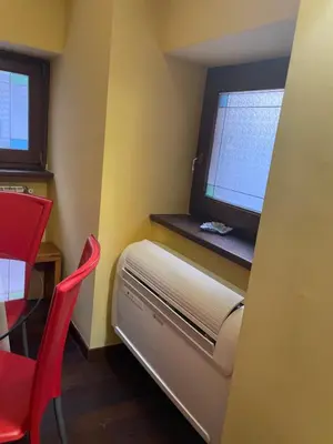 a small room with a heater and a window at Giglio apartment Navona in Rome