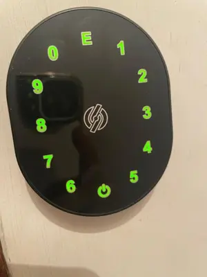 a clock with green numbers on a wall at Giglio apartment Navona in Rome