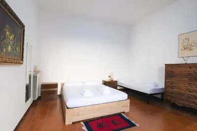 a room with a bed and a tub in it at A casa da Giordi in Rome