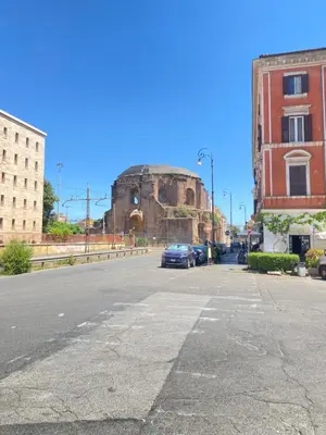 an empty street in front of an old building at A casa da Giordi in Rome