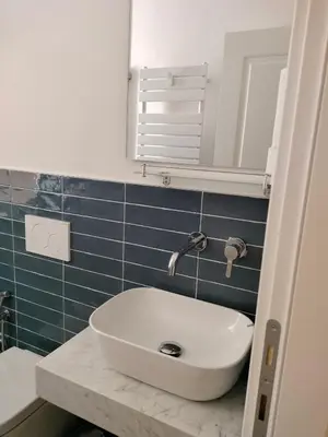 a bathroom with a sink and a mirror at Harmony in Rome ll in Rome