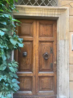 a wooden door in a brick building with at Harmony in Rome ll in Rome