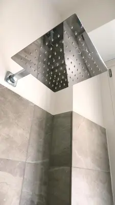 a bathroom with a shower with a ceiling at Scipioni245 Charme Apartment in Rome