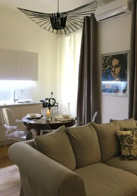 a living room with a couch and a table at Scipioni245 Charme Apartment in Rome
