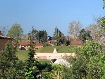 a bridge over a road with a green field at Sunshine Suite in Rome