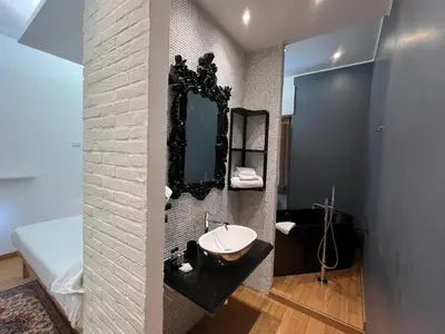 a bathroom with a sink and a mirror at Alileo At The Vatican in Rome