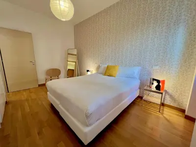 a bedroom with a large white bed in a room at Alileo At The Vatican in Rome