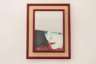 a framed picture of a woman with a window at Cozy & Chic Apartment - Piazza Bologna in Rome