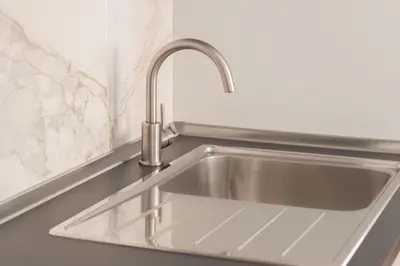 a stainless steel sink in a kitchen at Cozy & Chic Apartment - Piazza Bologna in Rome