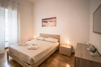a bedroom with a bed with two towels on it at Esa apartment Flaminio in Rome
