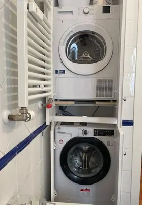 a washing machine and a washer in a small room at Interno 3 - Vatican Apartment in Rome
