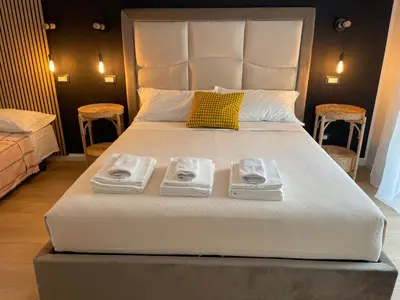 a bedroom with a large bed with two trays on it at Wow Rome Home in Rome