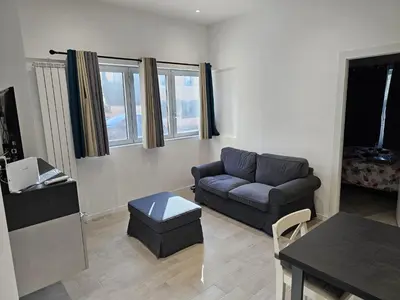 a living room with a couch and a table at EMHouse in Rome