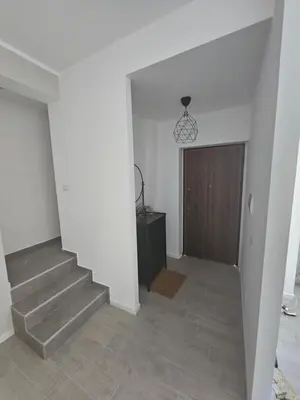 a hallway with stairs and a door in a house at EMHouse in Rome