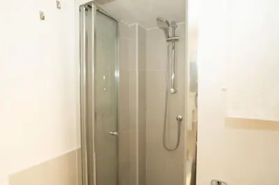 a shower with a glass door in a bathroom at Antuela Pantheon in Rome