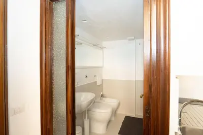 a bathroom with a toilet and a sink at Antuela Pantheon in Rome