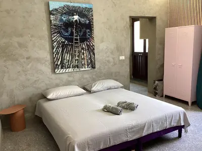 a bedroom with a bed with a stuffed animal on it at casa galleria d'arte in Rome